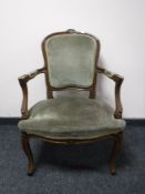 A French carver armchair in green dralon