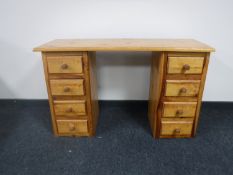 A pine twin pedestal dressing table