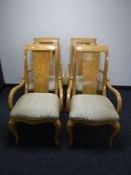 Four contemporary high backed dining chairs in a walnut finish