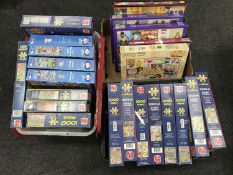 Three boxes of jigsaws
