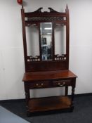 A mahogany mirrored hall stand fitted two drawers