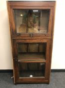 An Eastern hardwood fall-front glazed cabinet,