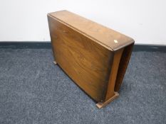 An Ercol elm drop leaf coffee table