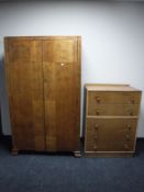 A double door oak wardrobe and a non-matching five drawer chest