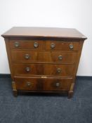 A Victorian inlaid mahogany five drawer chest labelled Hicks of Dublin