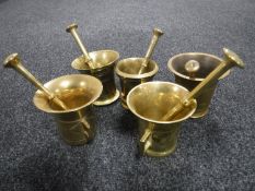Five brass pestle and mortars