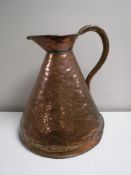 A large antique copper jug