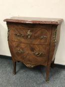 A two drawer walnut marble topped bombe chest,