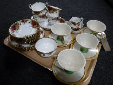 A tray containing four pottery Art Deco tea cups and saucers together with a Royal Standard sugar