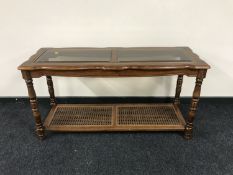 A colonial style two tier side table
