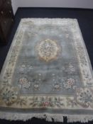 A fringed and embossed Chinese carpet