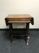 A nest of three mahogany tables with under stretchers