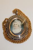A fine quality Georgian gold memorial pendant, the rose-coloured frame with blue and white enamel,