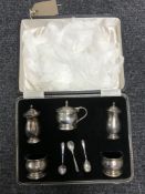 A cased silver cruet set