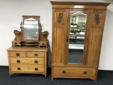 A satin walnut mirror door wardrobe and matching dressing chest