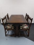 An Ercol refectory extending table and four chairs