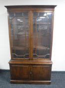 An early 20th century mahogany glazed door bookcase CONDITION REPORT: Measures