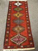 A Persian rug of geometric design,