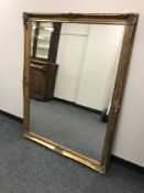 A gilt framed overmantel mirror,