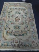 A fringed and embossed Chinese carpet