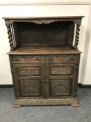 A Victorian heavily carved oak buffet sideboard,