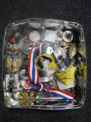 A tin of enamelled badges,