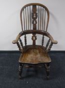 An elm wheel back armchair