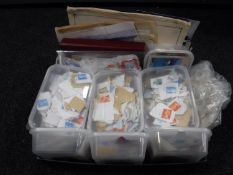 A large quantity of loose stamps and a 20th century stamp album,