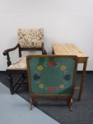 An early 20th century scroll arm armchair,