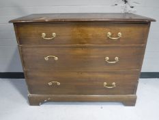 An Edwardian oak three drawer chest