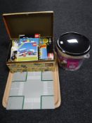 A tray of Lego including a bucket and box of Lego building bricks together with eight road base