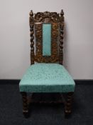 A Victorian carved oak hall chair