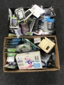 Two boxes containing digital camera, mobile phone accessories,
