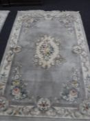 A fringed and embossed Chinese carpet