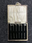 A set of six cased silver picks with cockerel finials