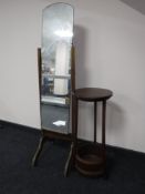 A cheval mirror on oak frame and a two tier plant stand
