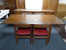 A mid 20th century teak six piece dining room suite