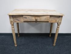A pine side table fitted a drawer