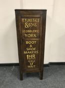 An Edwardian and later oak cabinet with cobbler's decoration