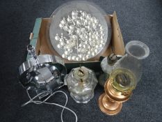 A box containing three oil lamps,