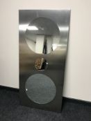 A contemporary metal framed mirror