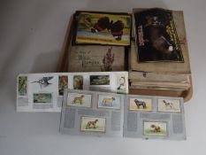 A tray of albums of cigarette and tea cards