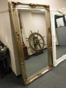 A large silvered bevelled mirror,
