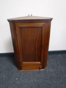 A 19th century mahogany corner cabinet