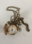 A 14ct gold fob watch upon rope twist chain