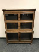 An Edwardian glazed oak sectional bookcase,