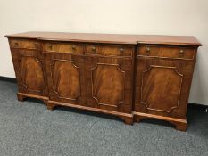 A reproduction mahogany breakfronted sideboard, width 205 cm.