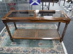 A colonial style two tier side table