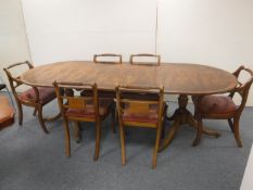 A Regency style dining table with leaf and six chairs