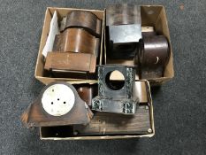 Four boxes containing mantel clock cases